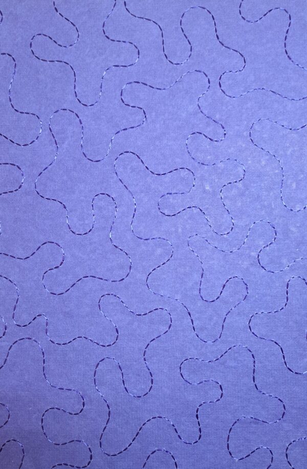 Achterkant geborduurd blauw met blauw Achterkant geborduurd blauw met blauw